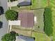Aerial view of home's roof and landscaped backyard featuring lawn and tall hedges at 3015 Liddington Rd, Matthews, NC 28105