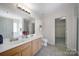 Bathroom with dual vanities, toilet, walk-in closet and separate shower/tub at 3015 Liddington Rd, Matthews, NC 28105