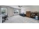Bright bedroom with a ceiling fan, a trundle bed, and a shelving unit at 3015 Liddington Rd, Matthews, NC 28105