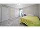 Bedroom featuring a single bed, a window, neutral walls, and closet storage at 3015 Liddington Rd, Matthews, NC 28105