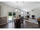 Bright dining area with hardwood floors, ample natural light, and easy access to the outdoor patio at 3015 Liddington Rd, Matthews, NC 28105