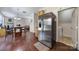 Stainless steel refrigerator in kitchen, with an eat-in area and access to the laundry room at 3015 Liddington Rd, Matthews, NC 28105