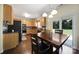 Charming eat-in kitchen with stainless steel appliances, ample counter space, and access to the backyard patio at 3015 Liddington Rd, Matthews, NC 28105