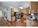 Well-equipped kitchen with stainless steel appliances, ample cabinet space, and easy access to the living room at 3015 Liddington Rd, Matthews, NC 28105