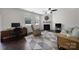 Inviting living room with a fireplace, hardwood floors, neutral paint, comfortable seating and lots of light at 3015 Liddington Rd, Matthews, NC 28105