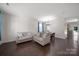 Bright and airy living room with hardwood floors, neutral paint, and furniture with backyard view at 3015 Liddington Rd, Matthews, NC 28105