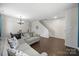Spacious living room with a dining area, neutral paint, hardwood floors, and ample natural light at 3015 Liddington Rd, Matthews, NC 28105