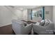 Inviting living room featuring hardwood floors, neutral paint, comfortable seating, and natural light at 3015 Liddington Rd, Matthews, NC 28105
