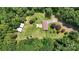 Expansive aerial view showcasing the home, storage building, and surrounding greenery at 3151 Lynn Mountain Rd, Vale, NC 28168