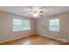 Bedroom featuring two windows and wood flooring at 3151 Lynn Mountain Rd, Vale, NC 28168