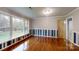Spacious bedroom with hardwood floors, large windows offering natural light, and decorative wall accents at 3151 Lynn Mountain Rd, Vale, NC 28168