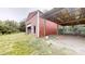 Exterior view of the storage building with a convenient carport, blending functionality with outdoor accessibility at 3151 Lynn Mountain Rd, Vale, NC 28168