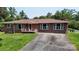 Charming brick home with a well-maintained lawn, featuring a classic design and welcoming front porch at 3151 Lynn Mountain Rd, Vale, NC 28168