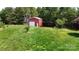 Storage building exterior with an attached carport in a tranquil, green setting at 3151 Lynn Mountain Rd, Vale, NC 28168