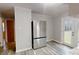 Kitchen features stainless steel appliances, white cabinets, and a door to the backyard at 3151 Lynn Mountain Rd, Vale, NC 28168