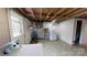 Laundry room includes washer, dryer, utility sink, and access to the basement bathroom at 3151 Lynn Mountain Rd, Vale, NC 28168