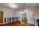 Open living area with hardwood floors, decorative columns, and neutral paint, offering a versatile living space at 3151 Lynn Mountain Rd, Vale, NC 28168