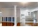 Bright living room featuring hardwood floors, neutral paint, and an open layout leading into the kitchen at 3151 Lynn Mountain Rd, Vale, NC 28168