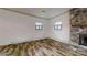 The living room has a stone fireplace, hardwood floors, and natural light at 3151 Lynn Mountain Rd, Vale, NC 28168