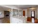 Open-concept living room with stone fireplace, marble counter, and large windows at 3151 Lynn Mountain Rd, Vale, NC 28168