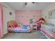 Charming pink bedroom with a cozy single bed and a vanity desk, perfect for a young  at 350 Moose Dr, Stony Point, NC 28678