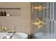 Close-up of elegant bathroom fixtures showcasing gold hardware and stylish tiling at 3822 Topsfield Rd, Charlotte, NC 28211