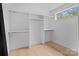 A naturally-lit walk-in closet with wood flooring and chrome racks for optimal storage at 3822 Topsfield Rd, Charlotte, NC 28211
