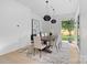 Dining room with modern light fixtures and a view of the backyard at 3822 Topsfield Rd, Charlotte, NC 28211