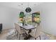 Dining area with a large table and chairs, flowing onto the outdoor area at 3822 Topsfield Rd, Charlotte, NC 28211