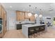 Modern kitchen featuring a large island, stylish pendant lighting, and sleek cabinetry at 3822 Topsfield Rd, Charlotte, NC 28211
