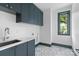 Well-designed laundry room with custom cabinetry and stylish flooring at 3822 Topsfield Rd, Charlotte, NC 28211