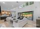 Bright and airy living space with an open floor plan leading to a modern kitchen and outdoor patio at 3822 Topsfield Rd, Charlotte, NC 28211