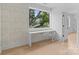 Inviting office space with a built-in desk, hardwood floors, and a serene view at 3822 Topsfield Rd, Charlotte, NC 28211