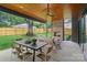 Outdoor patio with a fireplace and multiple seating and dining spaces at 3822 Topsfield Rd, Charlotte, NC 28211