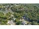 Panoramic aerial view of a property nestled among mature trees near a lake at 386 Squirrel Ln, Lake Wylie, SC 29710