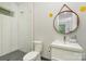 Well lit bathroom featuring a glass shower, mosaic tile and sleek floating vanity at 386 Squirrel Ln, Lake Wylie, SC 29710