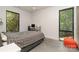 Comfortable bedroom featuring a desk with wooded views and modern gray tones at 386 Squirrel Ln, Lake Wylie, SC 29710