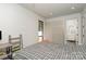 Bright bedroom featuring a desk, shelves and wooded views, with lots of natural light at 386 Squirrel Ln, Lake Wylie, SC 29710
