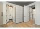 Hallway leading to closet and bathroom featuring wood floors, and an open design at 386 Squirrel Ln, Lake Wylie, SC 29710