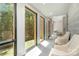 Hallway with natural light, large windows with green views, seating, and modern architectural features at 386 Squirrel Ln, Lake Wylie, SC 29710