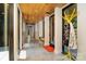 Long hallway with a wood ceiling, concrete floors, large windows, and modern design elements at 386 Squirrel Ln, Lake Wylie, SC 29710
