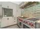 Close up of modern kitchen with stainless steel gas range and range hood at 386 Squirrel Ln, Lake Wylie, SC 29710