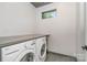 Well-lit laundry room featuring modern appliances and ample counter space at 386 Squirrel Ln, Lake Wylie, SC 29710
