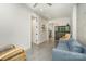 Living room with contemporary furniture, exposed concrete walls, and access to multiple rooms at 386 Squirrel Ln, Lake Wylie, SC 29710