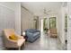 An interior living space featuring contemporary furniture, large windows, and exposed concrete walls at 386 Squirrel Ln, Lake Wylie, SC 29710