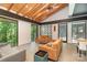 Bright living room with vaulted ceilings, exposed wood beams, and nature views at 386 Squirrel Ln, Lake Wylie, SC 29710