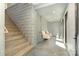 Staircase with concrete block wall, wood steps and handrail, and access to the upper levels at 386 Squirrel Ln, Lake Wylie, SC 29710