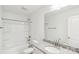 Well-lit bathroom showcasing a granite countertop, oval sink, toilet and shower-tub combination at 401 W Charlotte Ave, Mount Holly, NC 28120