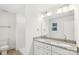 Bathroom features double vanity with granite countertop and all-white color scheme at 401 W Charlotte Ave, Mount Holly, NC 28120