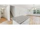 A modern kitchen featuring a granite countertop island and wood flooring at 401 W Charlotte Ave, Mount Holly, NC 28120